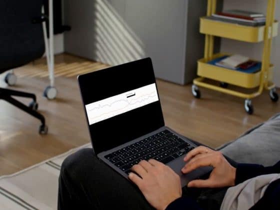 Close-up of a laptop showing the sharp downward graph of the Google Search Console impression drop, which was caused by Bot Traffic Skewing GSC Data.