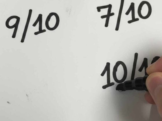 Scores out of 10 being written by a sharpie pen.